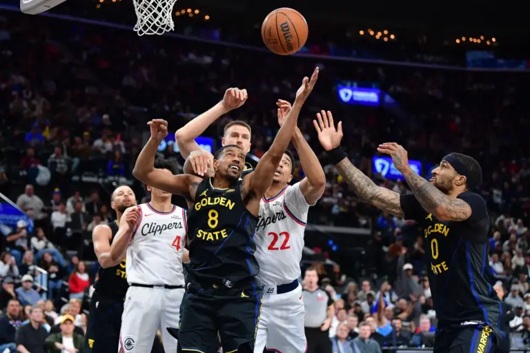Apr 12, 2026; Inglewood, California, USA; Golden State Warriors guard De'anthony Melton (8) and guard Gary Payton II (0) play for the rebound against Los Angeles Clippers guard Jordan Miller (22) and guard Kobe Sanders (4) during the second half at Intuit Dome. Mandatory Credit: Gary A. Vasquez-Imagn Images
