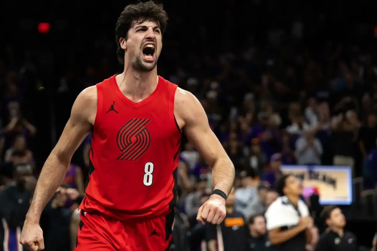 Portland Trail Blazers forward Deni Avdija (8) celebrates against the Phoenix Suns in the second half during the play-in rounds of the 2026 NBA Playoffs at Mortgage Matchup Center.