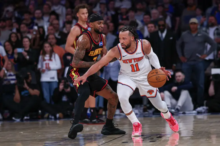 Apr 18, 2026; New York, New York, USA; New York Knicks guard Jalen Brunson (11) dribbles as Atlanta Hawks guard Nickeil Alexander-Walker (7) defends during the second half of the 2026 NBA Playoffs at Madison Square Garden. Mandatory Credit: Vincent Carchietta-Imagn Images