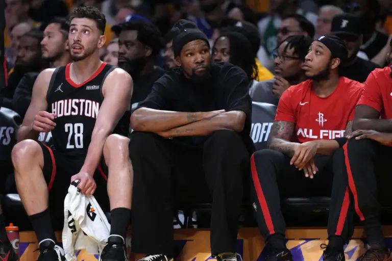 Apr 18, 2026; Los Angeles, California, USA; Houston Rockets center Alperen Sengun (28) and forward Kevin Durant (center) watch during the first half against the Los Angeles Lakers during game one of the first round of the 2026 NBA Playoffs at Crypto.com Arena. Mandatory Credit: Kirby Lee-Imagn Images