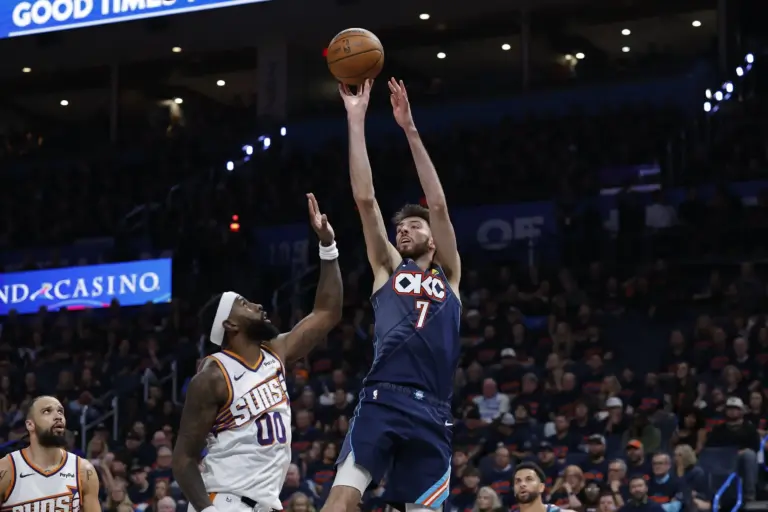Apr 22, 2026; Oklahoma City, Oklahoma, USA; Oklahoma City Thunder center Chet Holmgren (7) shoots as Phoenix Suns forward Royce O'Neale (00) defends in the second half during game two of the first round of the 2026 NBA Playoffs at Paycom Center. Mandatory Credit: Alonzo Adams-Imagn Images