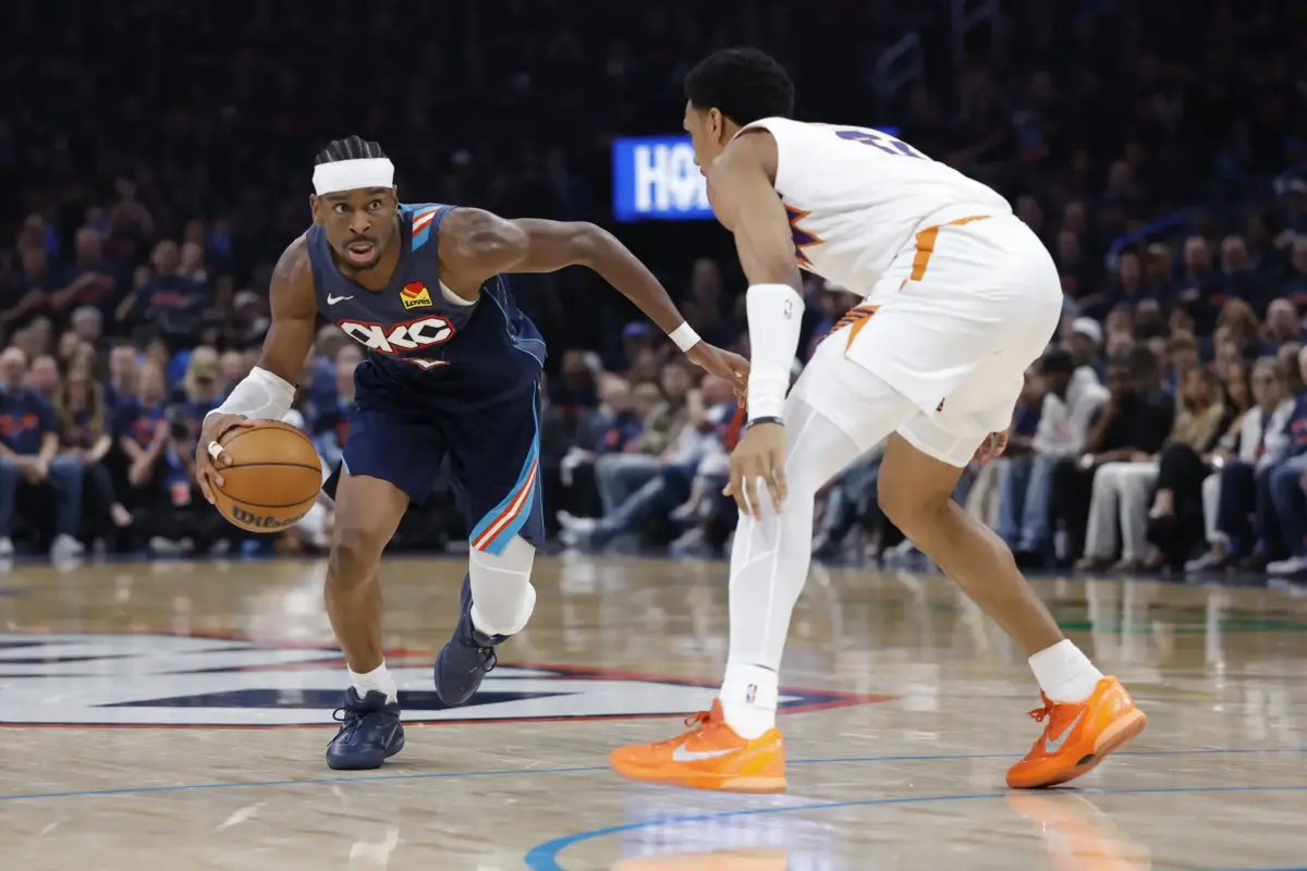 Apr 22, 2026; Oklahoma City, Oklahoma, USA; Oklahoma City Thunder guard Shai Gilgeous-Alexander (2) drives down the court around Phoenix Suns forward Ryan Dunn (0) in the second half during game two of the first round of the 2026 NBA Playoffs at Paycom Center. Mandatory Credit: Alonzo Adams-Imagn Images