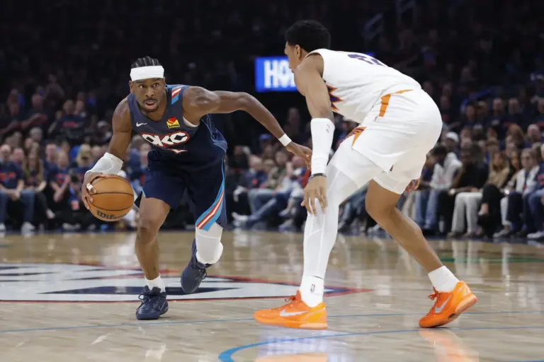 Apr 22, 2026; Oklahoma City, Oklahoma, USA; Oklahoma City Thunder guard Shai Gilgeous-Alexander (2) drives down the court around Phoenix Suns forward Ryan Dunn (0) in the second half during game two of the first round of the 2026 NBA Playoffs at Paycom Center. Mandatory Credit: Alonzo Adams-Imagn Images