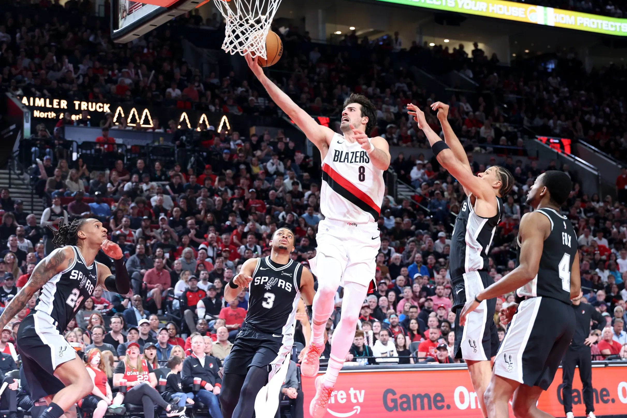 Apr 24, 2026; Portland, Oregon, USA; Portland Trail Blazers forward Deni Avdija (8) shoots the ball over San Antonio Spurs forward Keldon Johnson (3) during the first half during game three of the first round of the 2026 NBA Playoffs at Moda Center. Mandatory Credit: Jaime Valdez-Imagn Images