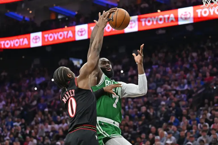 Apr 26, 2026; Philadelphia, Pennsylvania, USA; Boston Celtics guard Jaylen Brown (7) is defended by Philadelphia 76ers guard Tyrese Maxey (0) during the first half at Xfinity Mobile Arena. Mandatory Credit: Eric Hartline-Imagn Images