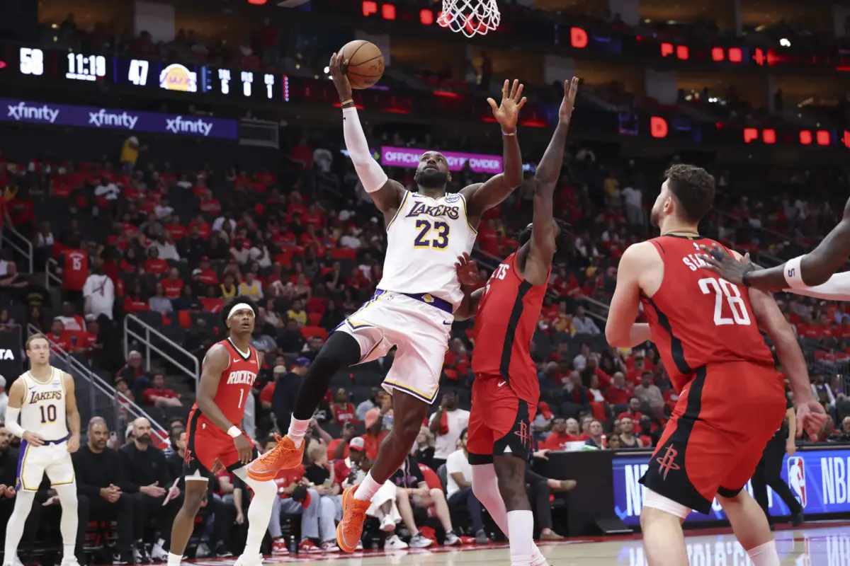 Los Angeles Lakers forward LeBron James (23) shoots the ball as Houston Rockets forward Tari Eason (17) defends during the third quarter during game four of the first round of the 2026 NBA Playoffs at Toyota Center.