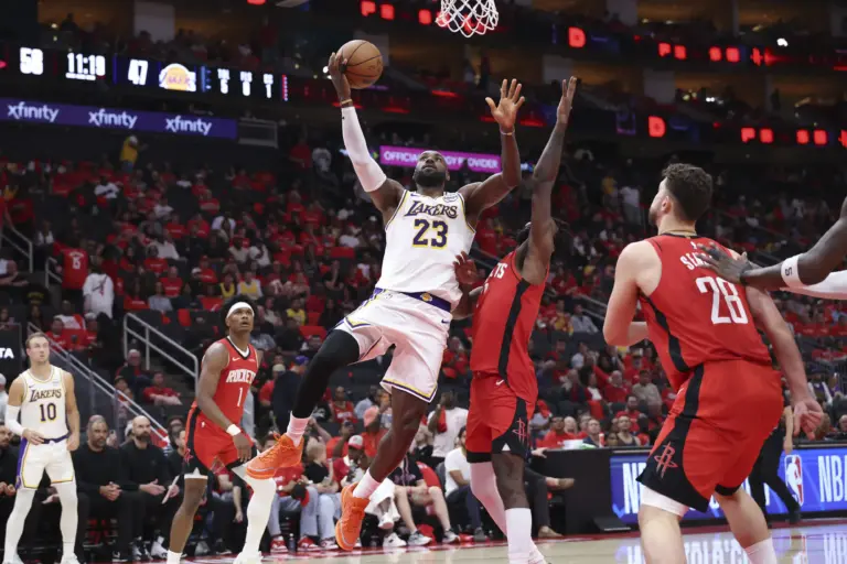 Los Angeles Lakers forward LeBron James (23) shoots the ball as Houston Rockets forward Tari Eason (17) defends during the third quarter during game four of the first round of the 2026 NBA Playoffs at Toyota Center.