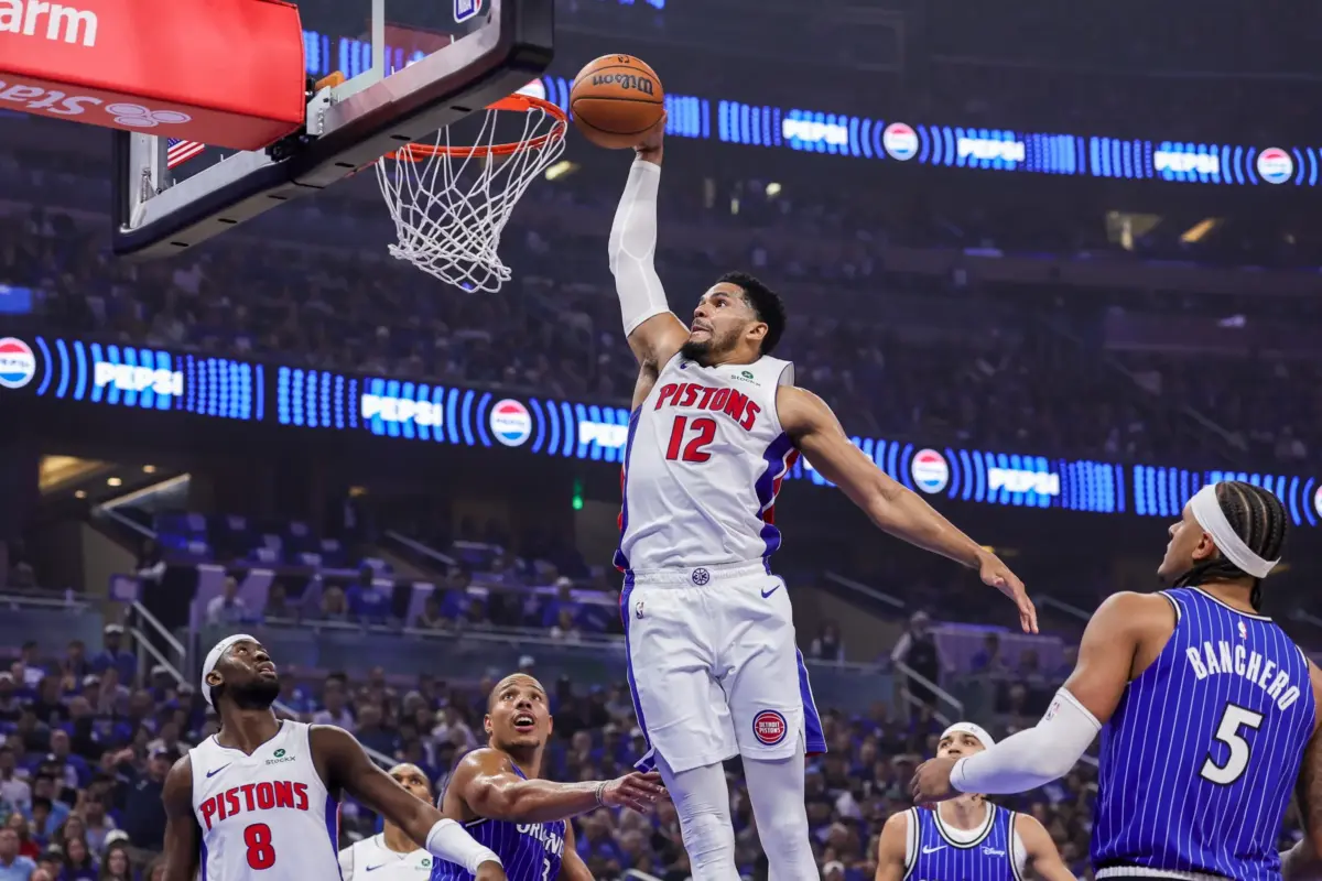 Apr 27, 2026; Orlando, Florida, USA; Detroit Pistons forward Tobias Harris (12) dunks against Orlando Magic guard Desmond Bane (3) during the second quarter during game four of the first round of the 2026 NBA Playoffs at Kia Center. Mandatory Credit: Mike Watters-Imagn Images