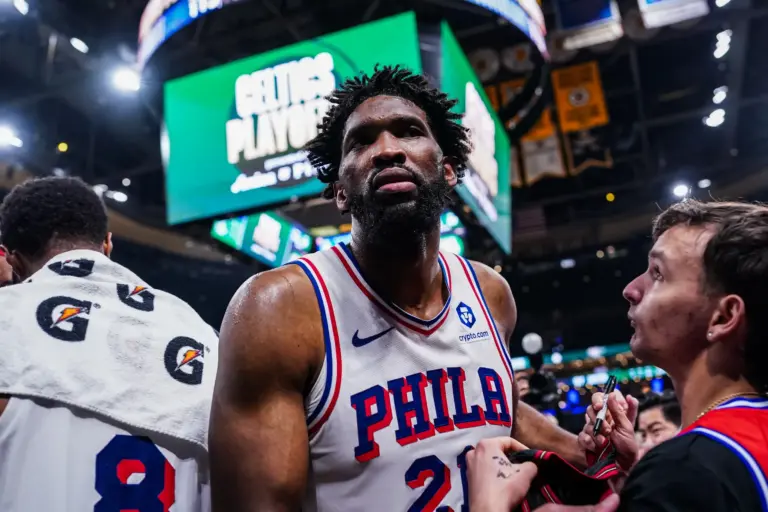Philadelphia 76ers center Joel Embiid (21) exits the court after the game against the Boston Celtics in game five of the first round of the 2026 NBA Playoffs at TD Garden.