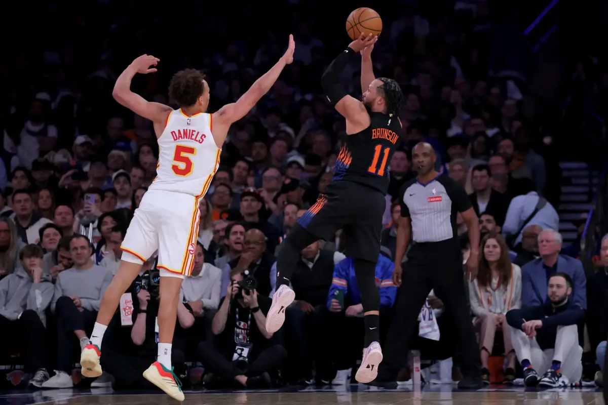 New York Knicks guard Jalen Brunson (11) takes a shot against Atlanta Hawks guard Dyson Daniels (5) during the third quarter of game five of the first round of the 2026 NBA Playoffs at Madison Square Garden.