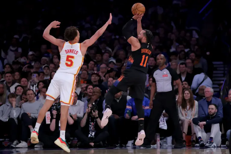 New York Knicks guard Jalen Brunson (11) takes a shot against Atlanta Hawks guard Dyson Daniels (5) during the third quarter of game five of the first round of the 2026 NBA Playoffs at Madison Square Garden.