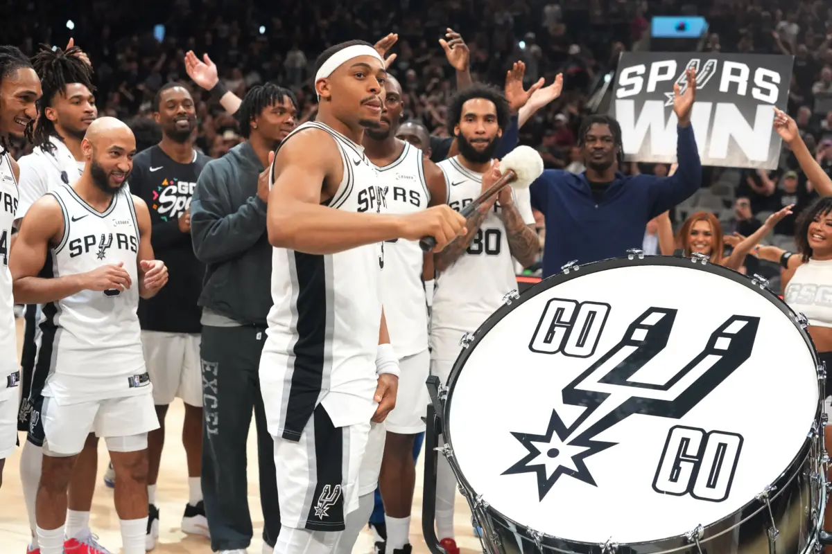 Apr 28, 2026; San Antonio, Texas, USA; San Antonio Spurs forward Keldon Johnson (3) beats the drum to celebrate along with teammates after a victory in game five of the first round of the 2026 NBA Playoffs against the Portland Trail Blazers at Frost Bank Center. Mandatory Credit: Scott Wachter-Imagn Images