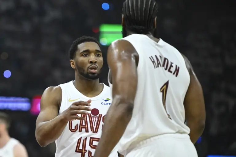 Cleveland Cavaliers guard Donovan Mitchell (45) talks to guard James Harden (1) against the Toronto Raptors in the first quarter of game five of the first round of the 2026 NBA Playoffs at Rocket Arena.