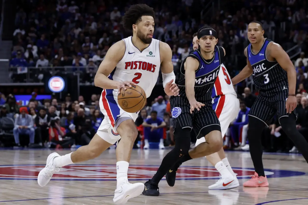Detroit Pistons guard Cade Cunningham (2) dribbles on Orlando Magic guard Anthony Black (0) in the second half uring game five of the first round of the 2026 NBA Playoffs at Little Caesars Arena.