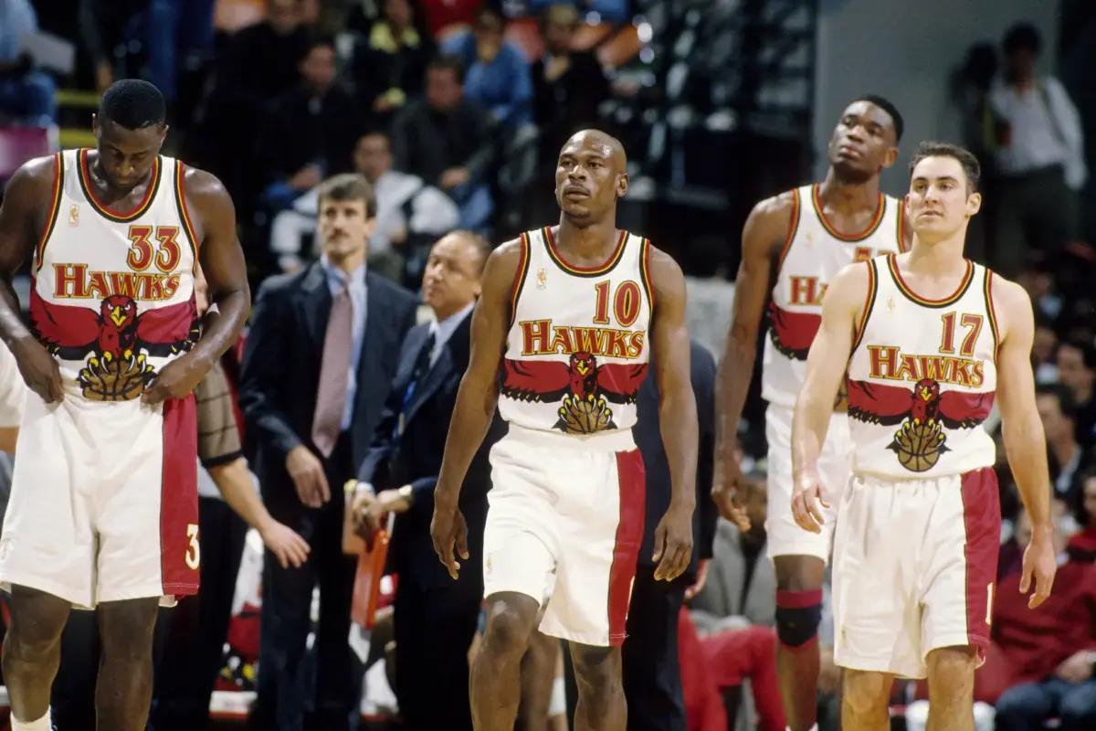Atlanta Hawks guard Mookie Blaylock (10), Tyrone Corbin (33), Jon Barry (17) and Dikembe Mutombo (55) against the Chicago Bulls at the Omni.