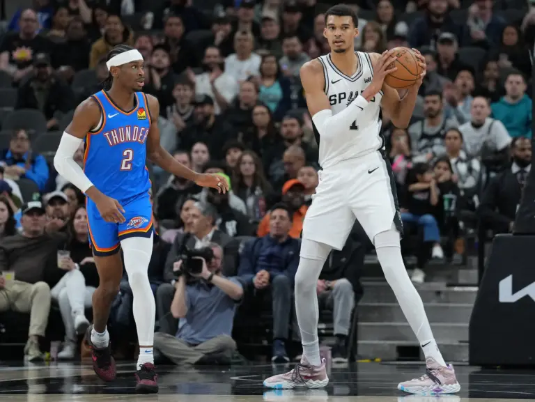San Antonio Spurs center Victor Wembanyama (1) looks down the court beside Oklahoma City Thunder guard Shai Gilgeous-Alexander (2) in the first half at Frost Bank Center. A new chapter in the Thunder vs Spurs rivalry is right around the corner.