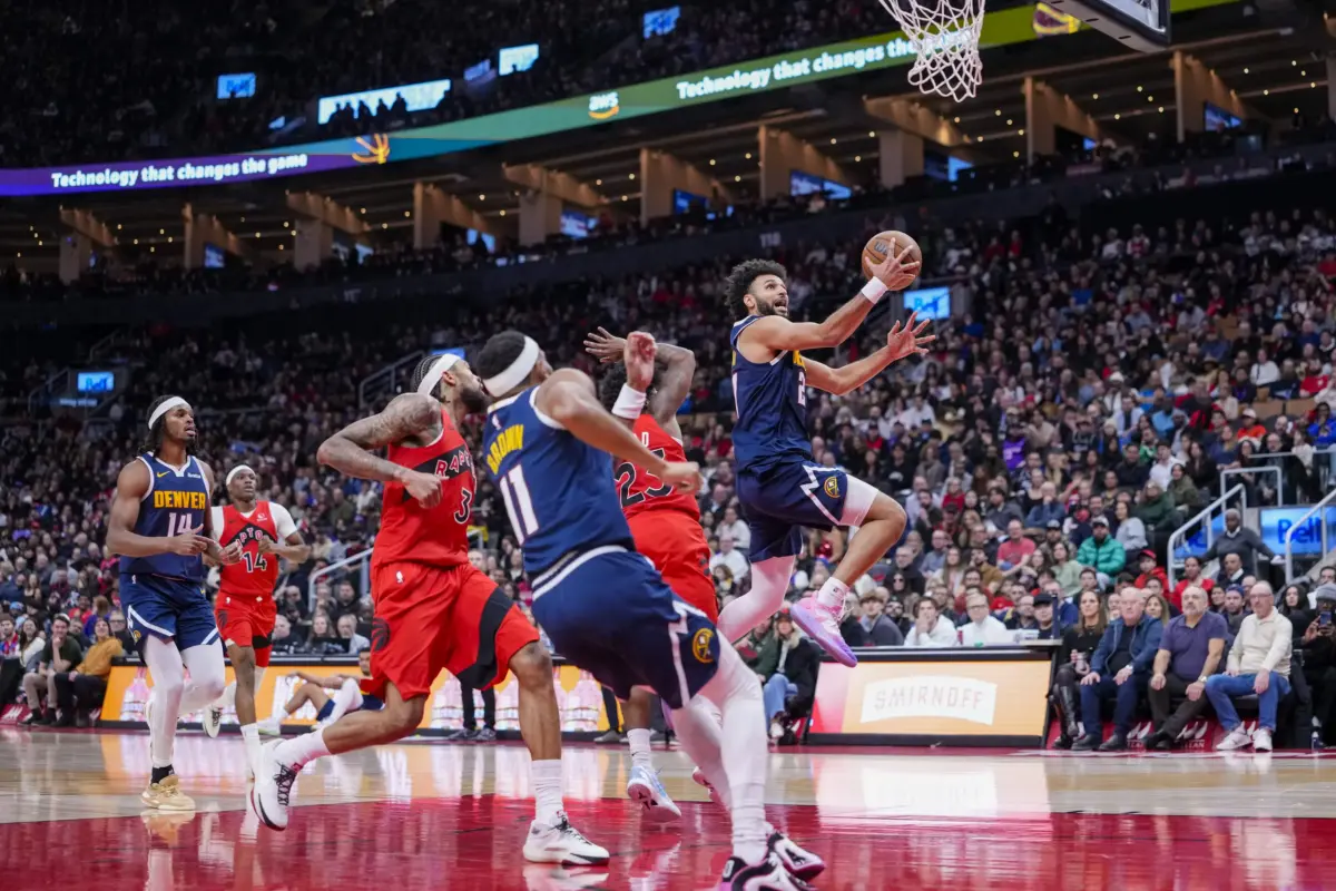 Dec 31, 2025; Toronto, Ontario, CAN; Denver Nuggets guard Jamal Murray (27) drives to the basket against the Toronto Raptors during the second half at Scotiabank Arena. Mandatory Credit: Kevin Sousa-Imagn Images