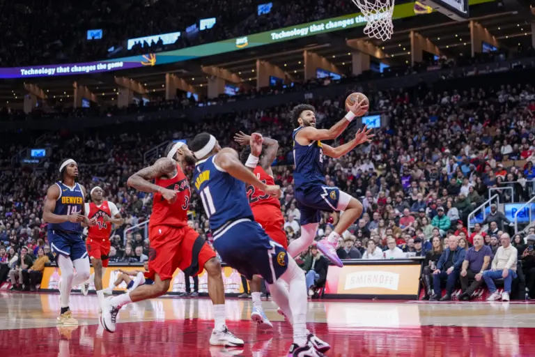 Dec 31, 2025; Toronto, Ontario, CAN; Denver Nuggets guard Jamal Murray (27) drives to the basket against the Toronto Raptors during the second half at Scotiabank Arena. Mandatory Credit: Kevin Sousa-Imagn Images