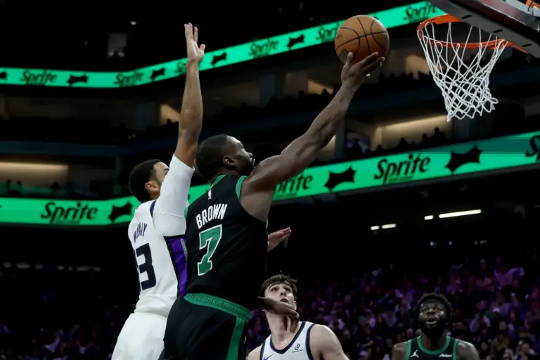 Boston Celtics star Jaylen Brown attempts a layup against the Sacramento Kings defense