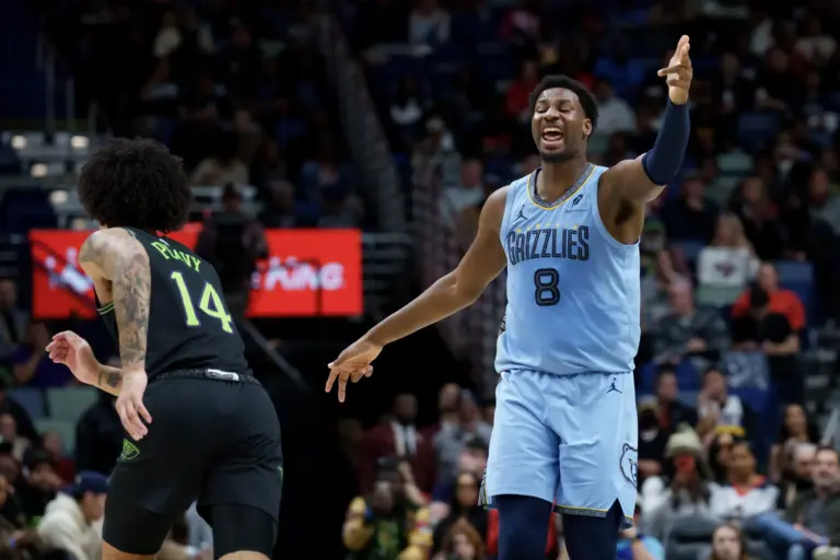 Memphis Grizzlies forward Jaren Jackson Jr. (8) reacts after a three point basket against New Orleans Pelicans guard Micah Peavy (14) during the first half at Smoothie King Center.