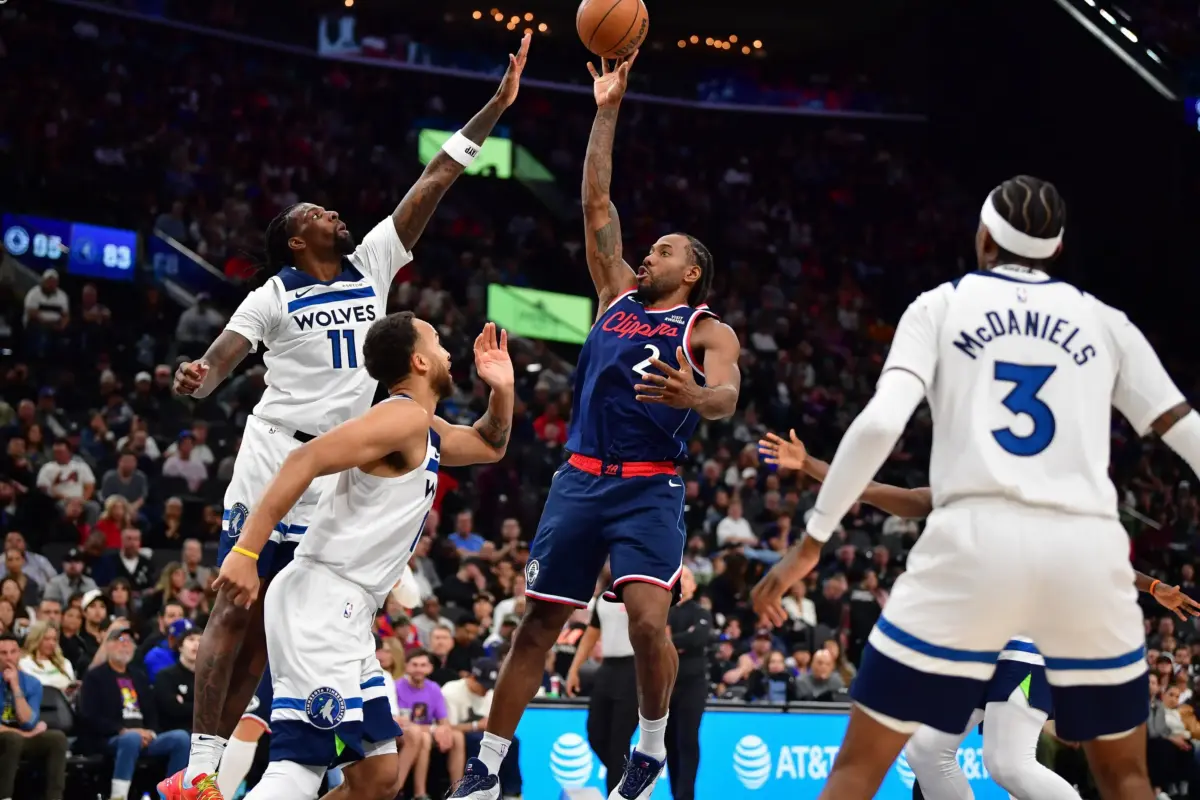 Los Angeles Clippers forward Kawhi Leonard (2) shoots against Minnesota Timberwolves center Naz Reid (11) during the second half at Intuit Dome.