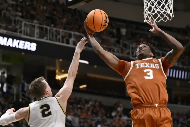 Texas Longhorns forward Dailyn Swain (3) rebounds the ball against Purdue Boilermakers guard Fletcher Loyer (2) in the first half during a Sweet Sixteen game of the West Regional of the men's 2026 NCAA Tournament at SAP Center.