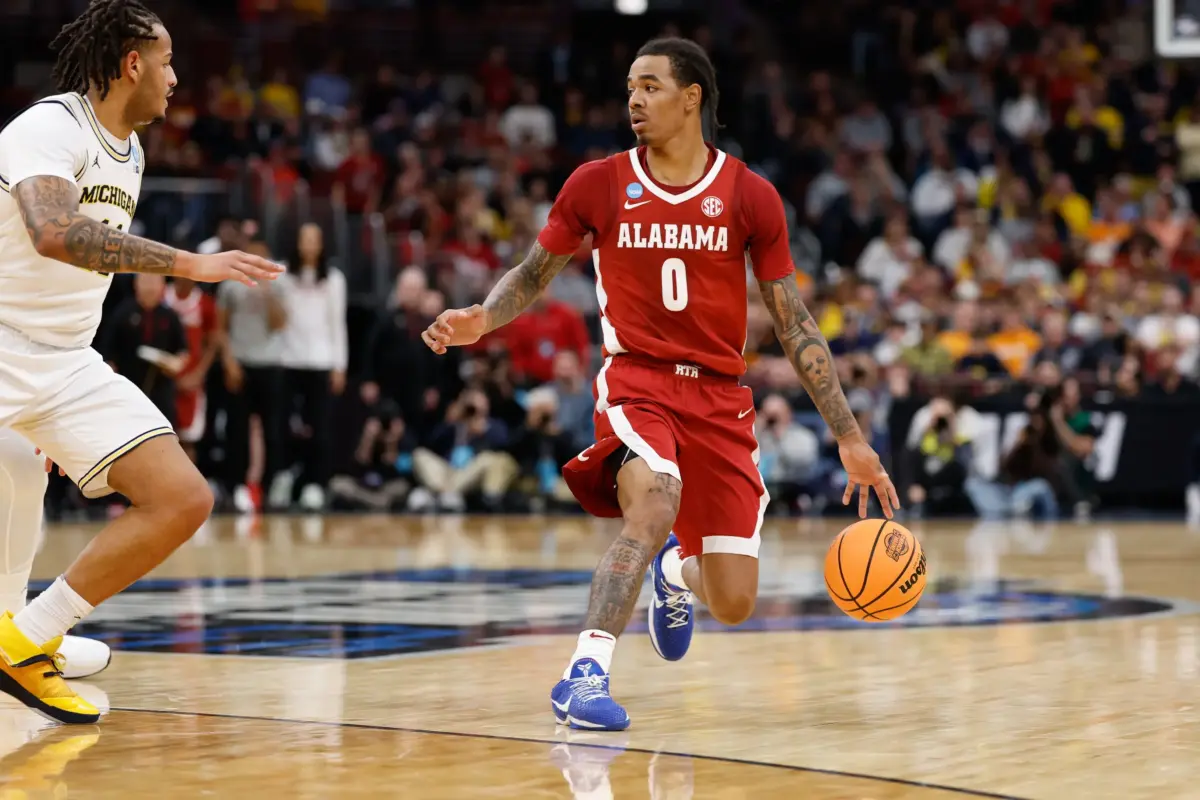 Alabama Crimson Tide guard Labaron Philon Jr. (0) looks to pass during the first half against the Michigan Wolverines during a Sweet Sixteen game of the Midwest Regional of the men's 2026 NCAA Tournament at United Center. The Charlotte Hornets have the 14th overall pick in the 2026 NBA Draft.