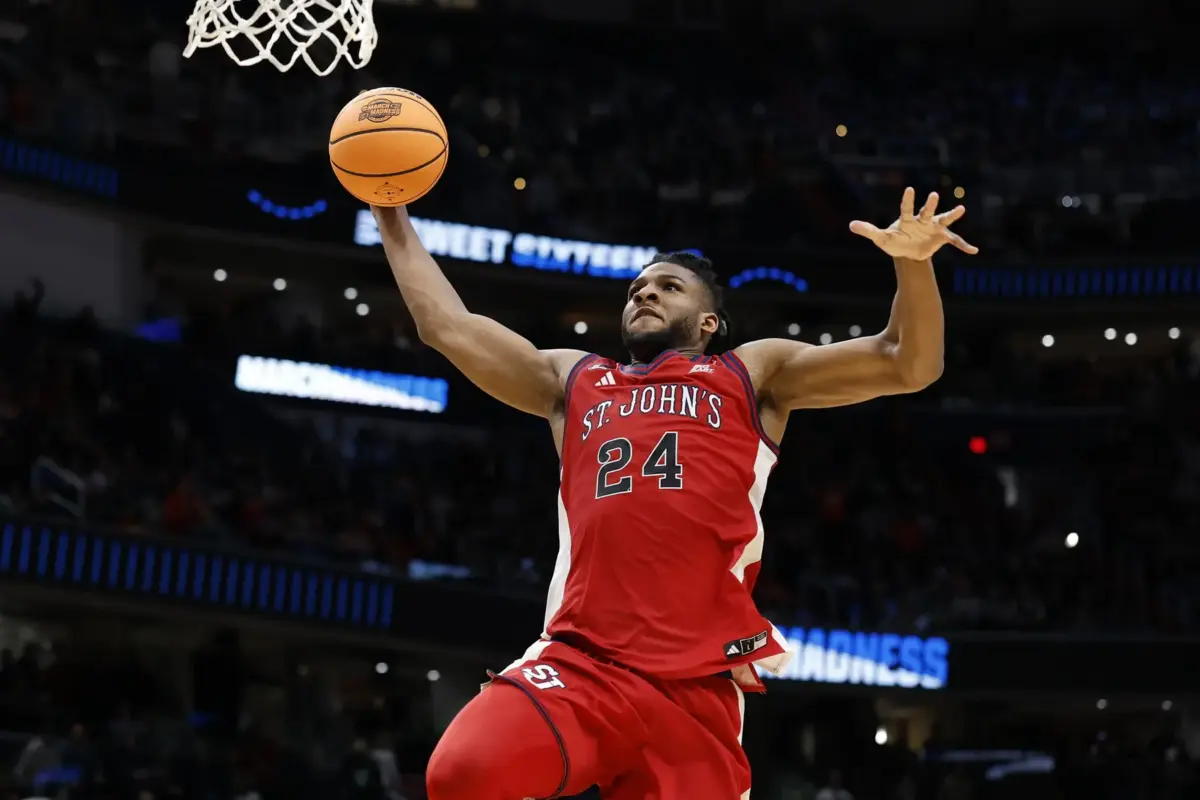 St. John's Red Storm forward Zuby Ejiofor (24) goes in for a dunk against the Duke Blue Devils in the second half during a Sweet Sixteen game of the East Regional of the men's 2026 NCAA Tournament at Capital One Arena.