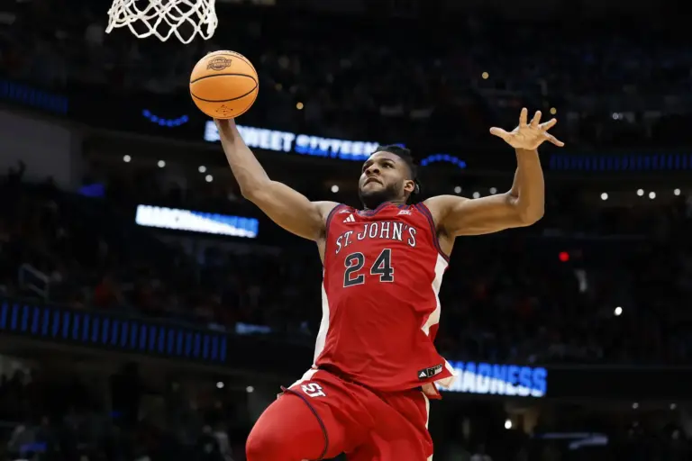 St. John's Red Storm forward Zuby Ejiofor (24) goes in for a dunk against the Duke Blue Devils in the second half during a Sweet Sixteen game of the East Regional of the men's 2026 NCAA Tournament at Capital One Arena.