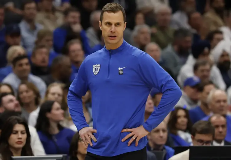 Duke Blue Devils head coach Jon Scheyer looks on against the UConn Huskies in the first half during an Elite Eight game of the East Regional of the men's 2026 NCAA Tournament at Capital One Arena.