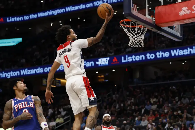 Washington Wizards forward Justin Champagnie (9) shoots the ball as Philadelphia 76ers guard Kelly Oubre Jr. (9) defends in the second half at Capital One Arena.