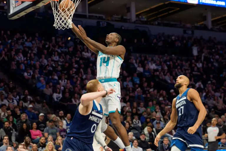 Charlotte Hornets forward Moussa Diabate (14) shoots over Minnesota Timberwolves guard Donte DiVincenzo (0) in the fourth quarter at Target Center.