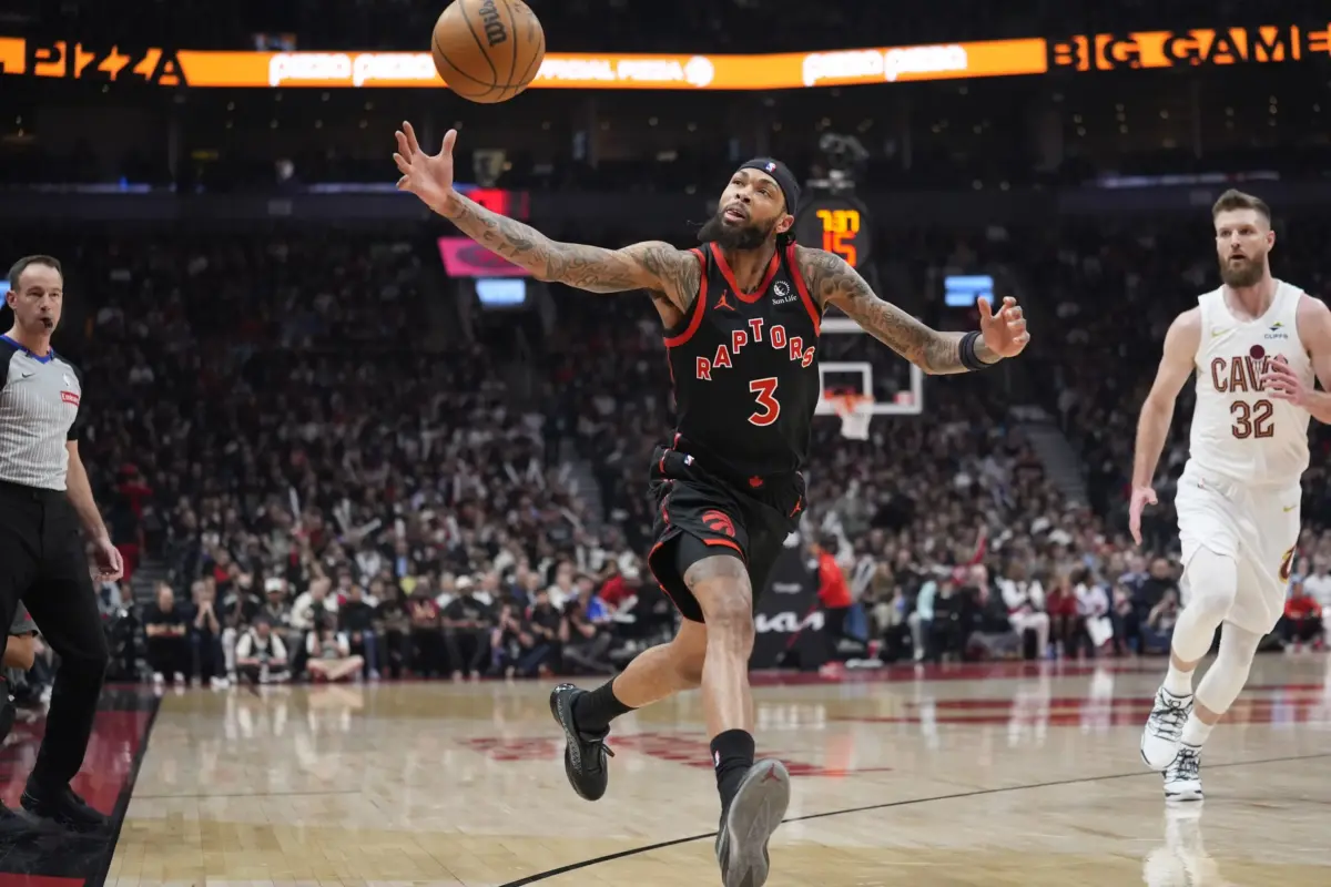 Apr 23, 2026; Toronto, Ontario, CAN; Toronto Raptors forward Brandon Ingram (3) tries to get control of a ball against the Cleveland Cavaliers during the first half of game three of the first round of the 2026 NBA Playoffs at Scotiabank Arena. Mandatory Credit: John E. Sokolowski-Imagn Images