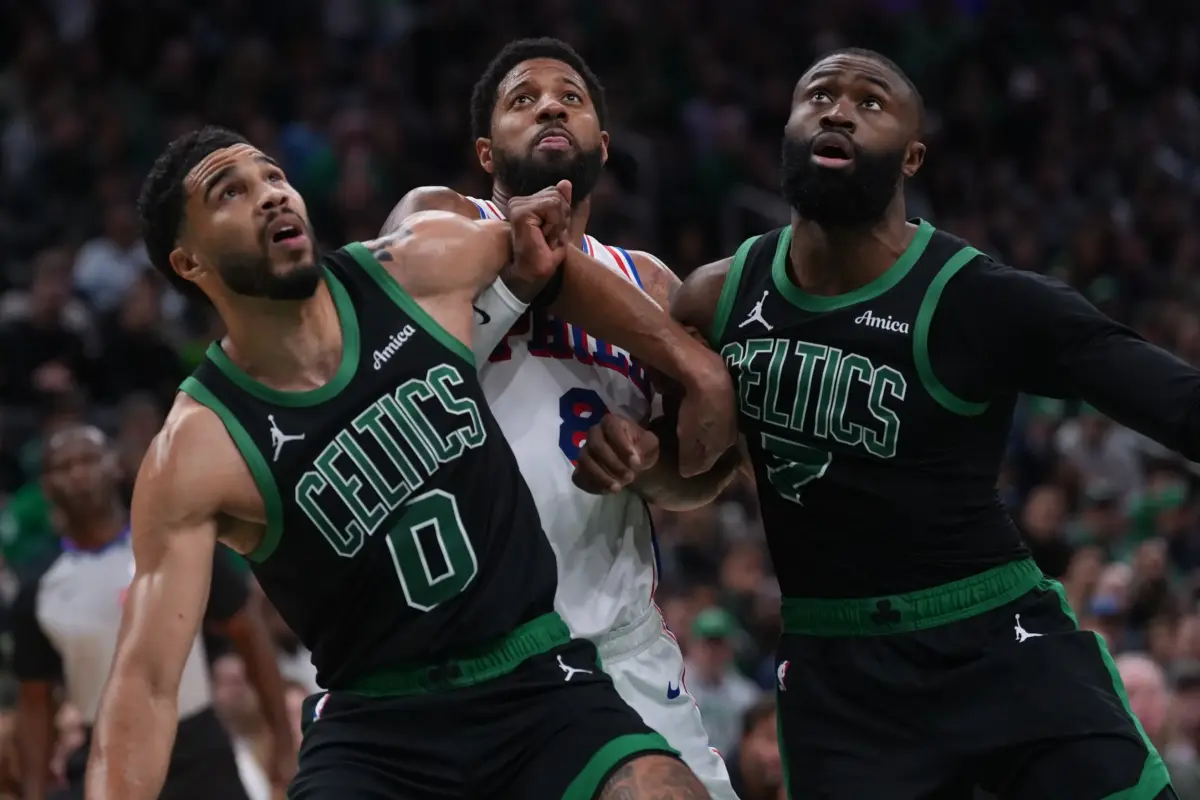 Boston Celtics stars Jayson Tatum and Jaylen Brown box out Philadelphia 76ers star Paul George