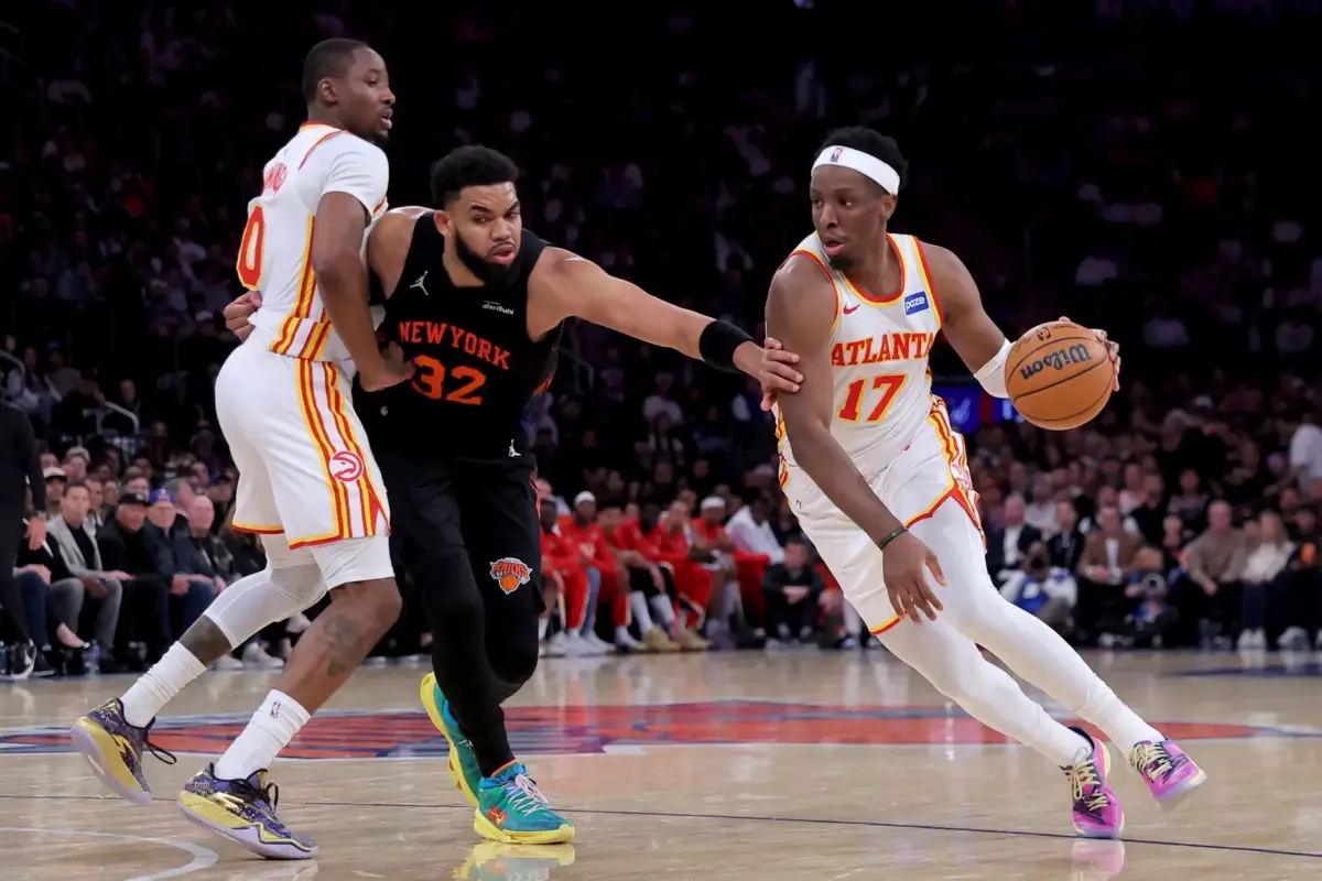 Apr 28, 2026; New York, New York, USA; Atlanta Hawks forward Onyeka Okongwu (17) drives to the basket around New York Knicks center Karl-Anthony Towns (32) as Hawks forward Jonathan Kuminga (0) sets a pick during the third quarter of game five of the first round of the 2026 NBA Playoffs at Madison Square Garden. Mandatory Credit: Brad Penner-Imagn Images