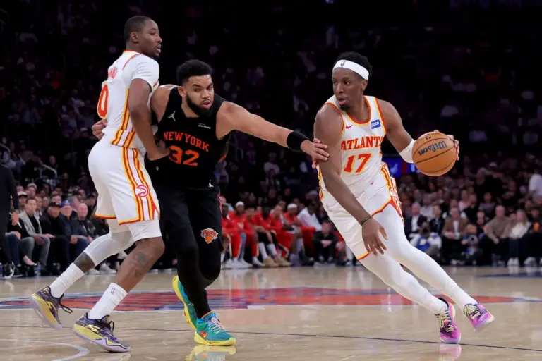 Apr 28, 2026; New York, New York, USA; Atlanta Hawks forward Onyeka Okongwu (17) drives to the basket around New York Knicks center Karl-Anthony Towns (32) as Hawks forward Jonathan Kuminga (0) sets a pick during the third quarter of game five of the first round of the 2026 NBA Playoffs at Madison Square Garden. Mandatory Credit: Brad Penner-Imagn Images