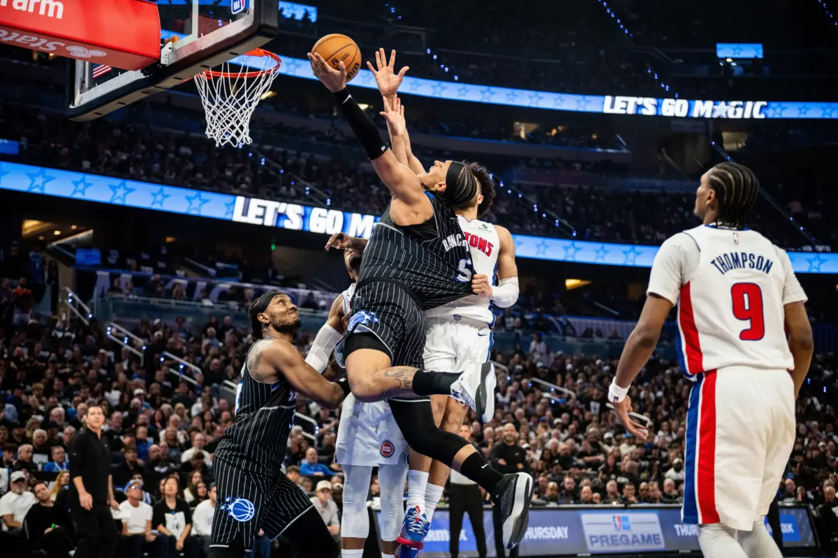 May 1, 2026; Orlando, Florida, USA; Orlando Magic forward Paolo Banchero (5) shoots the ball against Detroit Pistons guard Cade Cunningham (2) in the fourth quarter during game six of the first round of the 2026 NBA Playoffs at Kia Center. Mandatory Credit: Jeremy Reper-Imagn Images