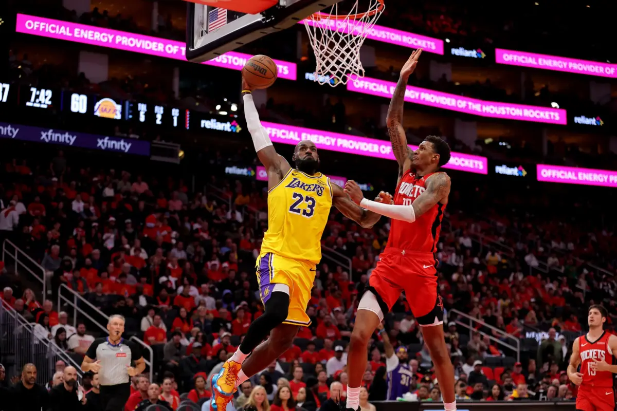 May 1, 2026; Houston, Texas, USA; Los Angeles Lakers forward Lebron James (23) looks to dunk against Houston Rockets forward Jabari Smith Jr. (10) during the third quarter of game six of the first round of the 2026 NBA Playoffs at Toyota Center. Mandatory Credit: Erik Williams-Imagn Images