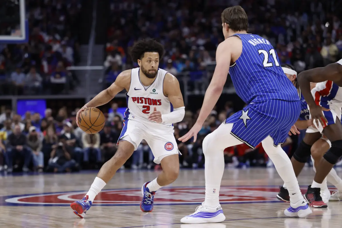 Detroit Pistons guard Cade Cunningham (2) dribbles defended by Orlando Magic forward Moritz Wagner (21) in the second half during game seven of the first round of the 2026 NBA Playoffs at Little Caesars Arena.