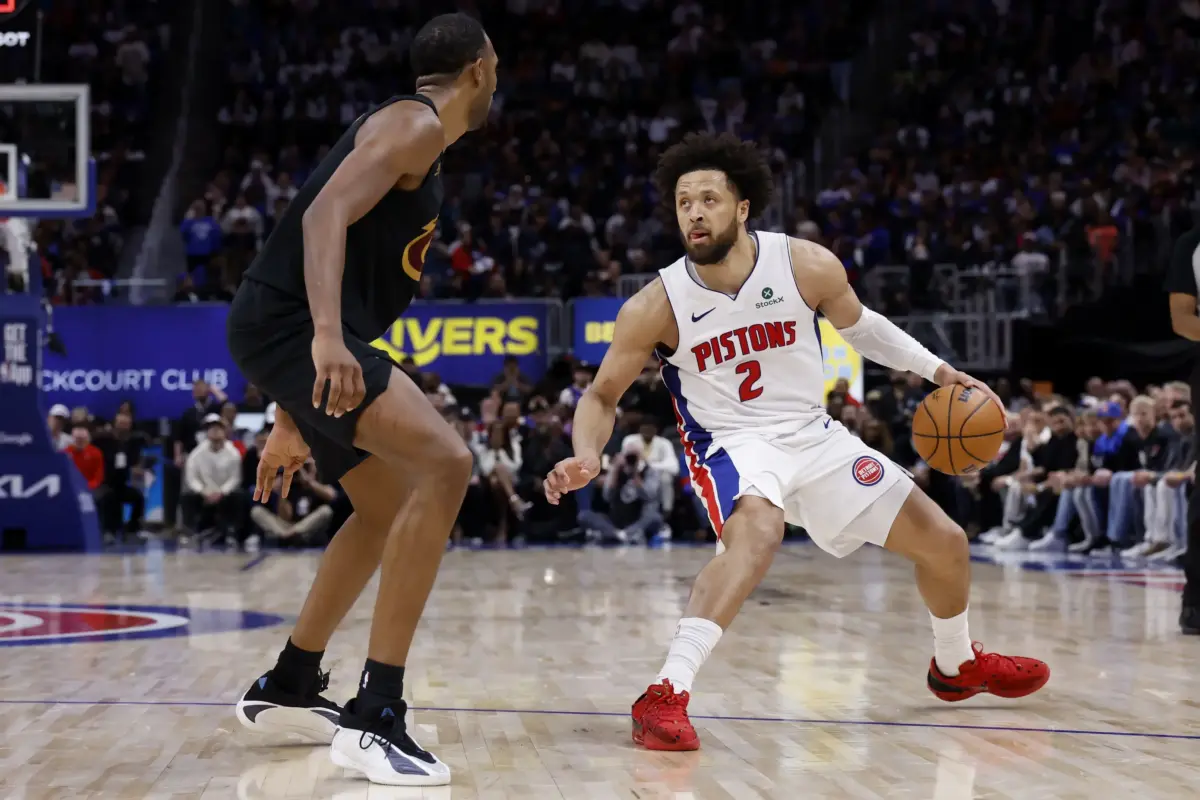 Detroit Pistons guard Cade Cunningham (2) dribbles defended by Cleveland Cavaliers center Evan Mobley (4) in the second half during game two of the second round of the 2026 NBA Playoffs at Little Caesars Arena.