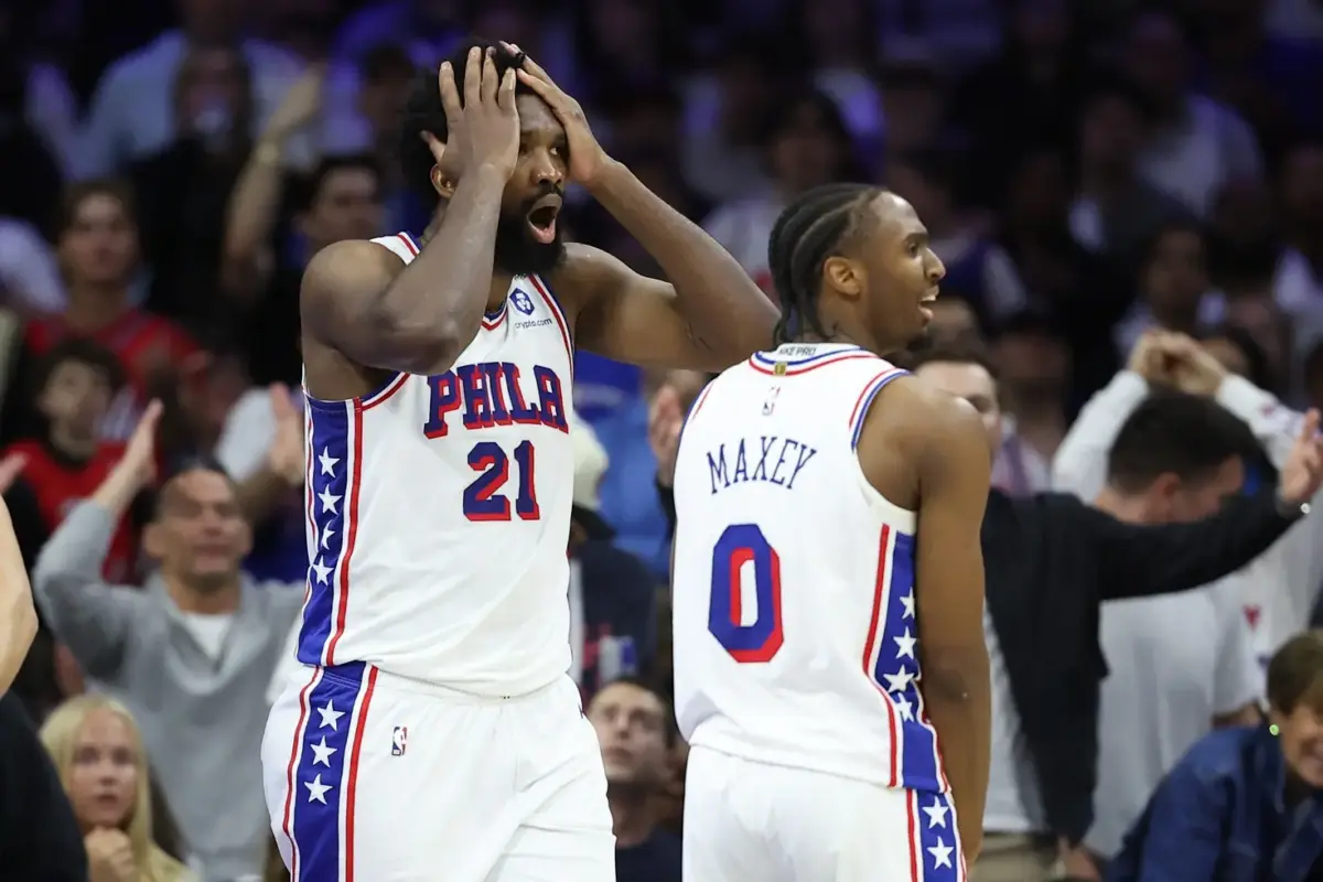 Philadelphia 76ers center Joel Embiid (21) reacts next to guard Tyrese Maxey (0) after a foul call during the third quarter of game three of the second round of the 2026 NBA Playoffs against the New York Knicks at Xfinity Mobile Arena.