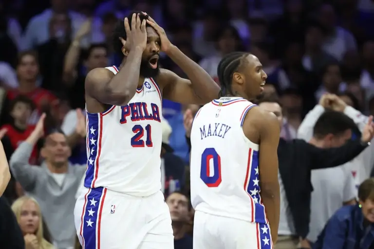 Philadelphia 76ers center Joel Embiid (21) reacts next to guard Tyrese Maxey (0) after a foul call during the third quarter of game three of the second round of the 2026 NBA Playoffs against the New York Knicks at Xfinity Mobile Arena.