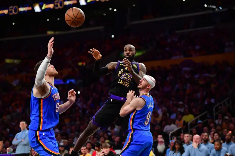 May 11, 2026; Los Angeles, California, USALos Angeles Lakers forward LeBron James (23) passes the ball against Oklahoma City Thunder center Isaiah Hartenstein (55) and guard Alex Caruso (9) during the first half in game four of the second round of the 2026 NBA Playoffs at Crypto.com Arena. Mandatory Credit: Gary A. Vasquez-Imagn Images
