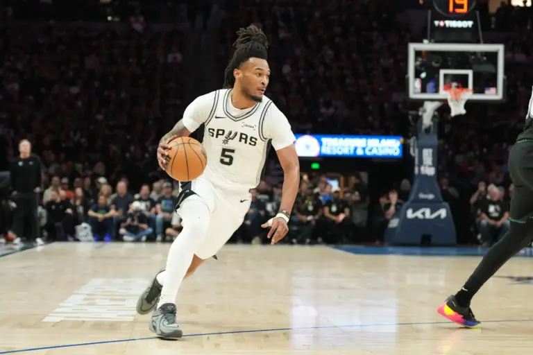 San Antonio Spurs guard Stephon Castle (5) dribbles the ball against the Minnesota Timberwolves in the first half during game six of the second round of the 2026 NBA Playoffs at Target Center.