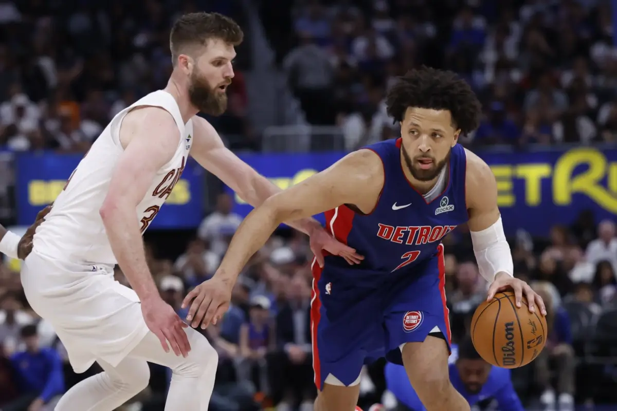 May 17, 2026; Detroit, Michigan, USA; Detroit Pistons guard Cade Cunningham (2) dribbles against Cleveland Cavaliers forward/center Dean Wade (32) in the second half during game seven of the second round of the 2026 NBA Playoffs at Little Caesars Arena. Mandatory Credit: Rick Osentoski-Imagn Images