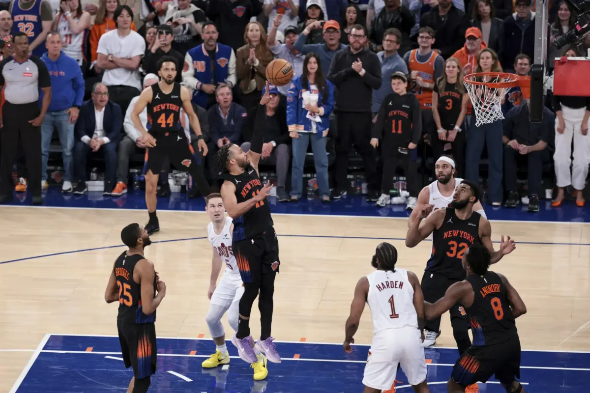 New York Knicks guard Jalen Brunson attempts a floater against he Cleveland Cavaliers defense