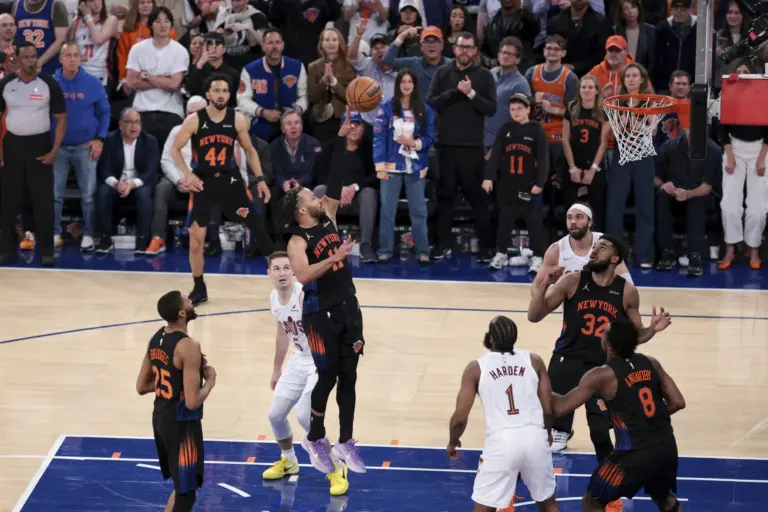 New York Knicks guard Jalen Brunson attempts a floater against he Cleveland Cavaliers defense