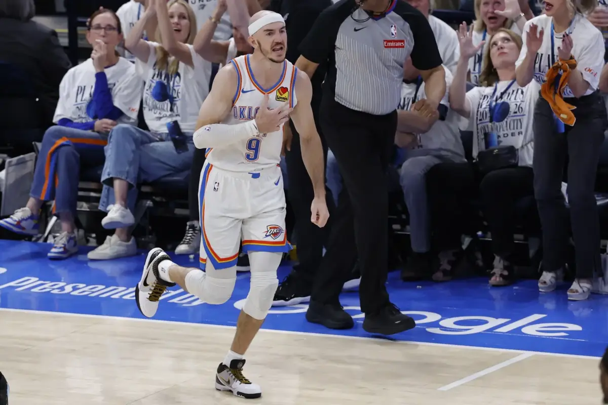 Oklahoma City Thunder guard Alex Caruso (9) reacts after a basket during the fourth quarter against the San Antonio Spurs in game five of the western conference finals for the 2026 NBA playoffs at Paycom Center.
