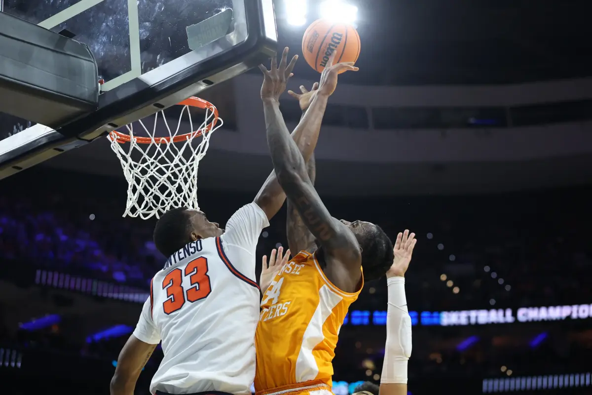 Mar 22, 2026; Philadelphia, PA, USA; Tennessee Volunteers center Felix Okpara (34) shoots the ball past Virginia Cavaliers center Ugonna Onyenso (33) in the first half during a second round game of the men's 2026 NCAA Tournament at Xfinity Mobile Arena. Mandatory Credit: Bill Streicher-Imagn Images. The Detroit Pistons drafted an elite shot blocker in Ugonna Onyenso.