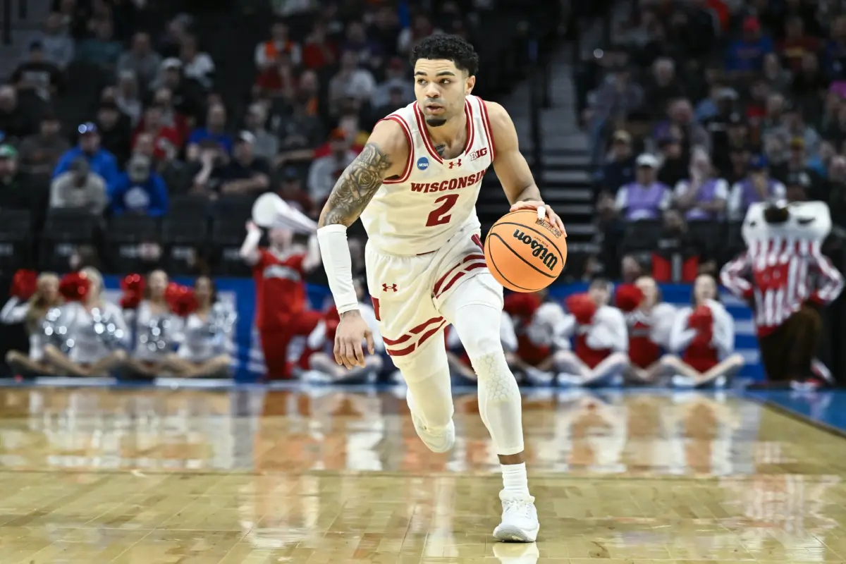 Mar 19, 2026; Portland, OR, USA; Wisconsin Badgers guard Nick Boyd (2) dribbles against the High Point Panthers during the first half of a first round game of the men's 2026 NCAA Tournament at Moda Center. Mandatory Credit: Craig Strobeck-Imagn Images